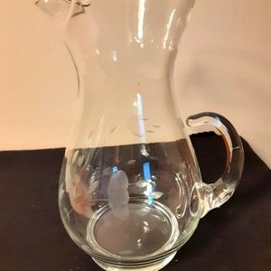 Clear glass pitcher with etchings